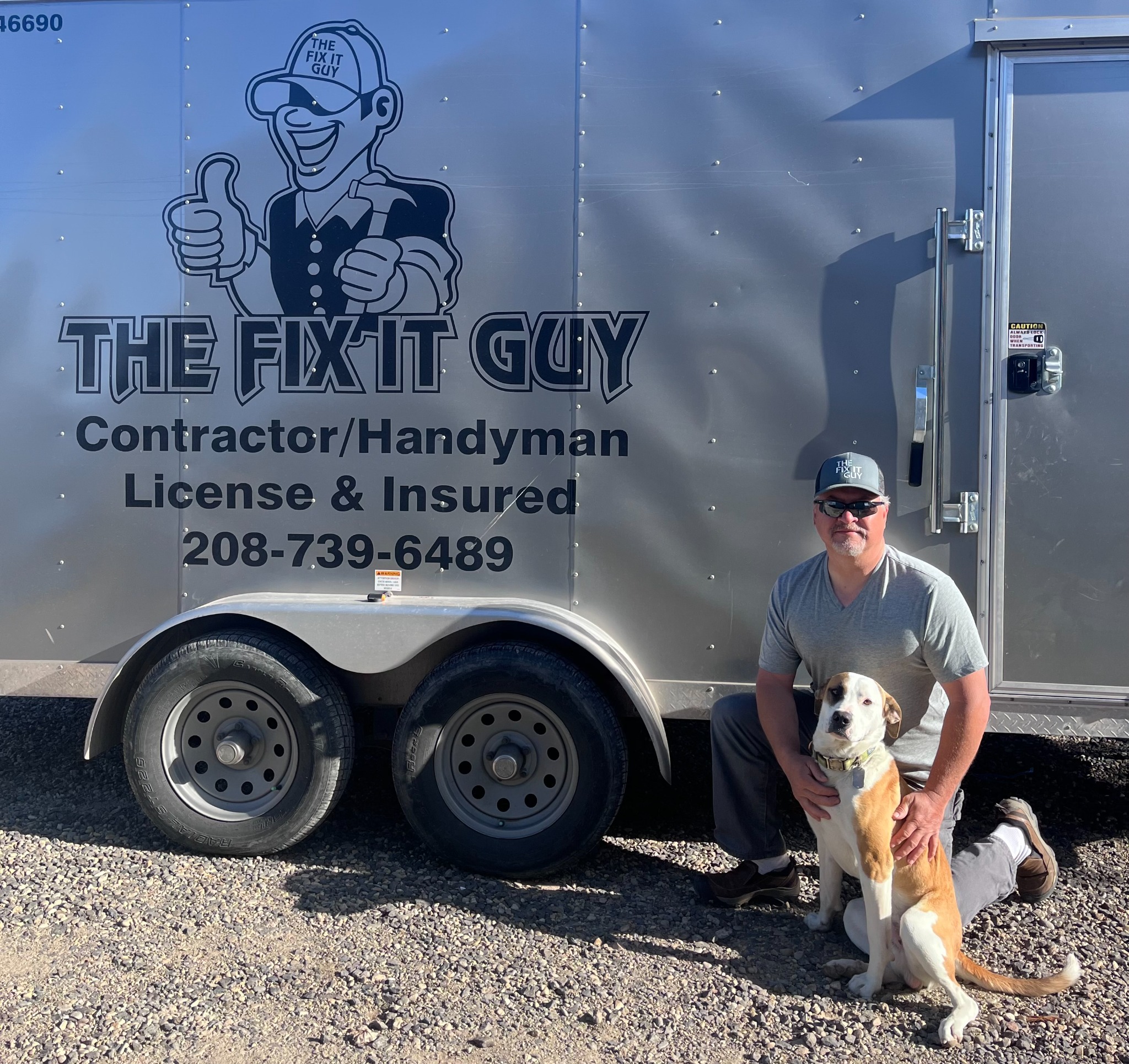 Eric Ross with his dog beside The Fix It Guy work trailer
